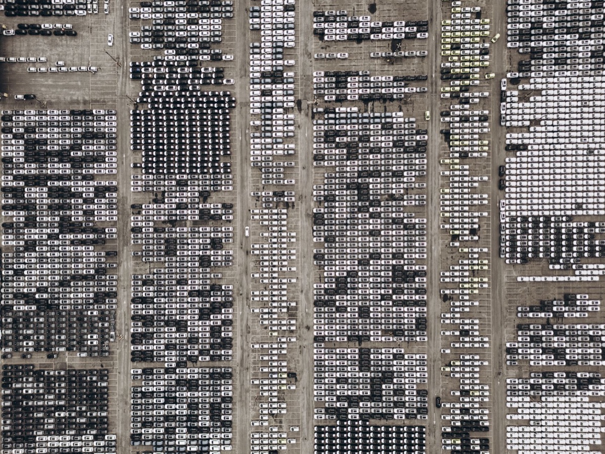 Automobile factory floor with machinery and workers