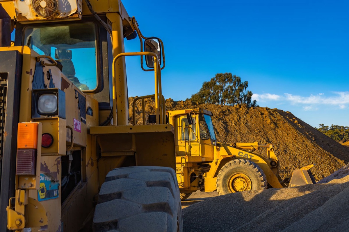 construction site with heavy equipment and workers